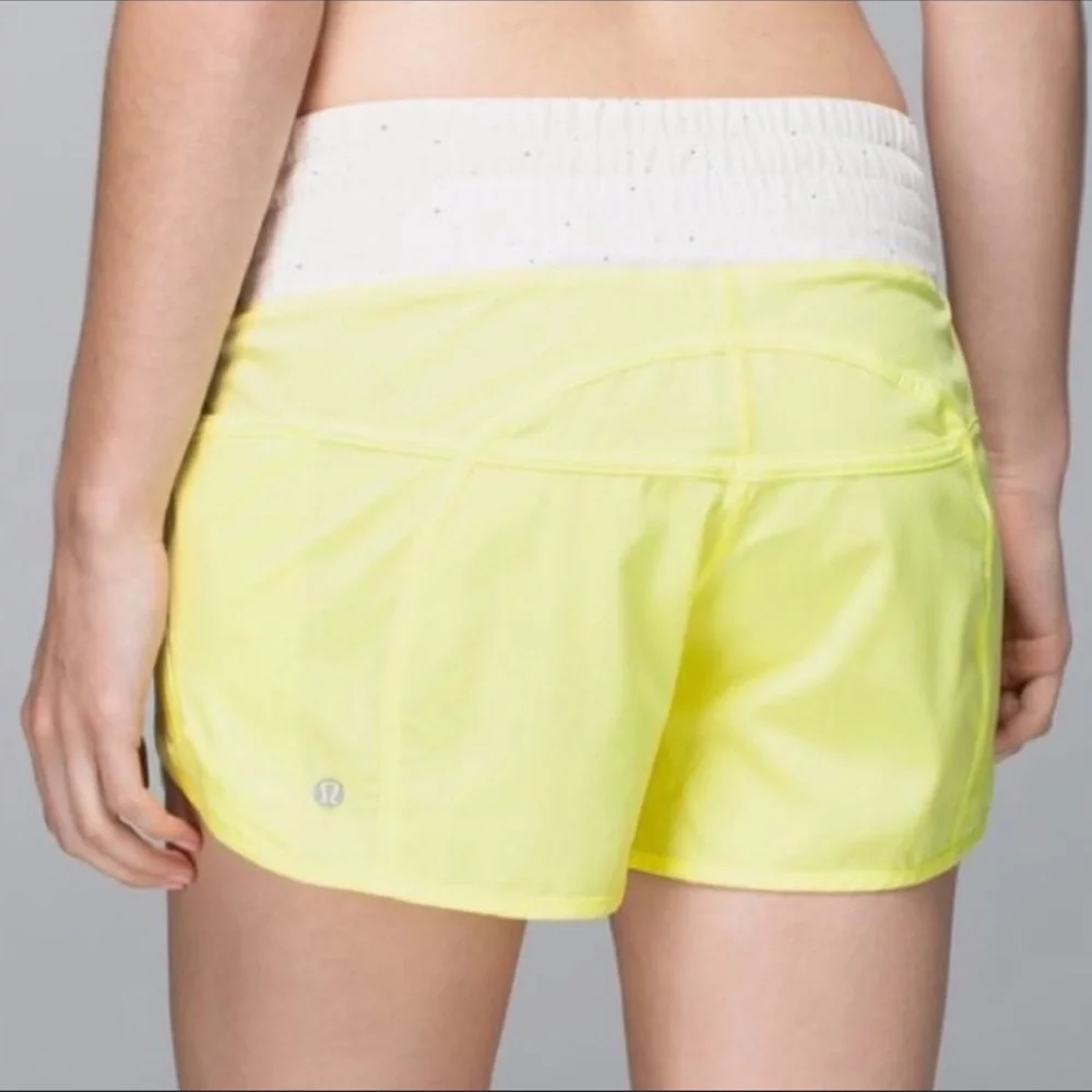 Lululemon Tracker Yellow Shorts with Multicolored Dot patterned waistband